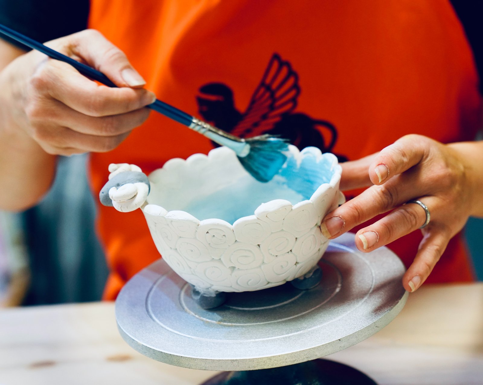 Close-up view of a ceramic plate ready for painting
