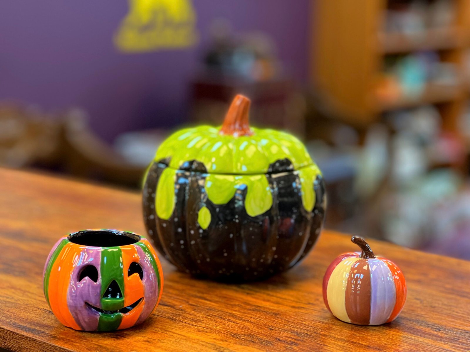 Painting a ceramic mug at Manna Pottery